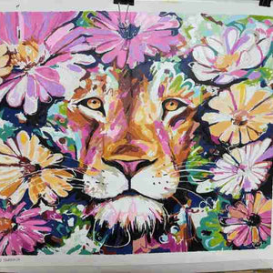 Colorful painting of a lion's face surrounded by flowers