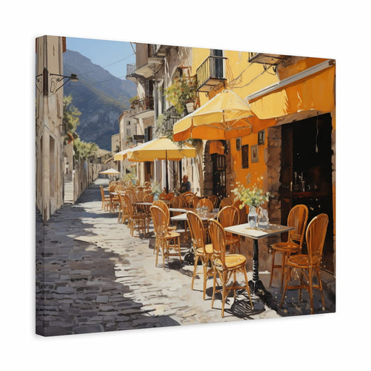 Paint by numbers artwork of a European village café with yellow umbrellas, wooden chairs, cobblestone street, and mountains in the distance shown in a frame