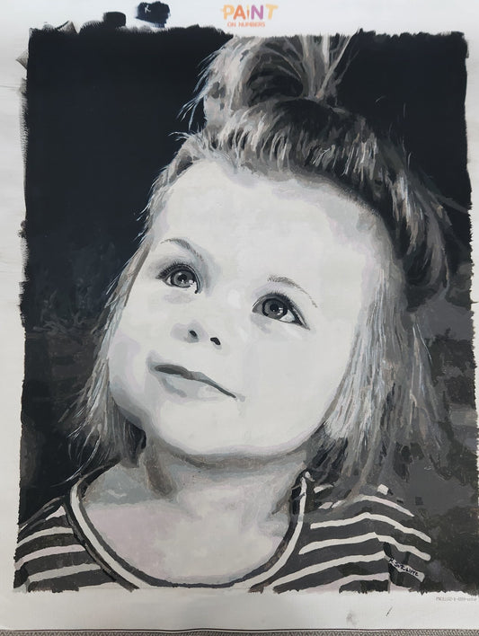 A black and white portrait drawing of a young child with a messy bun, rendered in a sketch-like style with rough painted edges. The artwork fills most of the frame, with a small 'PAINT On NUMBERS' logo visible at the top.