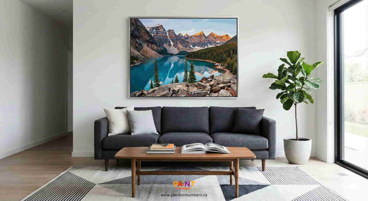 A completed and framed landscape paint by numbers kit hanging on a living room wall, looking like professional art.
