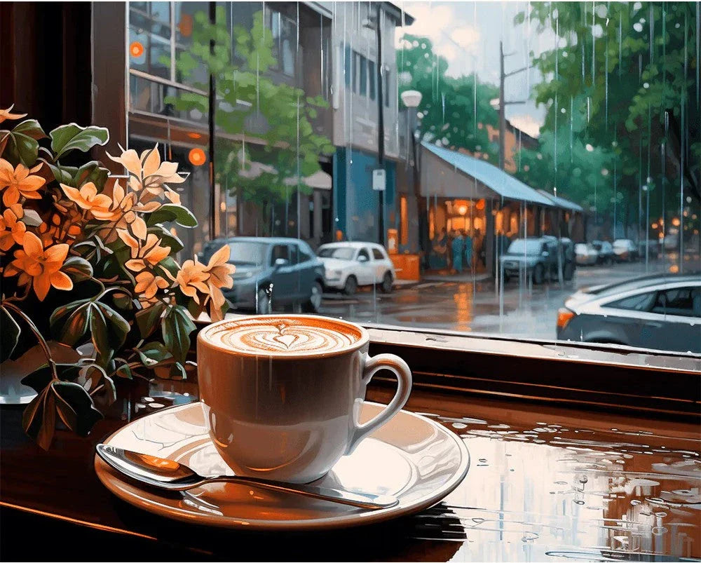 Paint By Numbers artwork of a steaming cup of coffee with heart-shaped latte art on a saucer by a rainy cafe window, overlooking a cozy urban street scene.