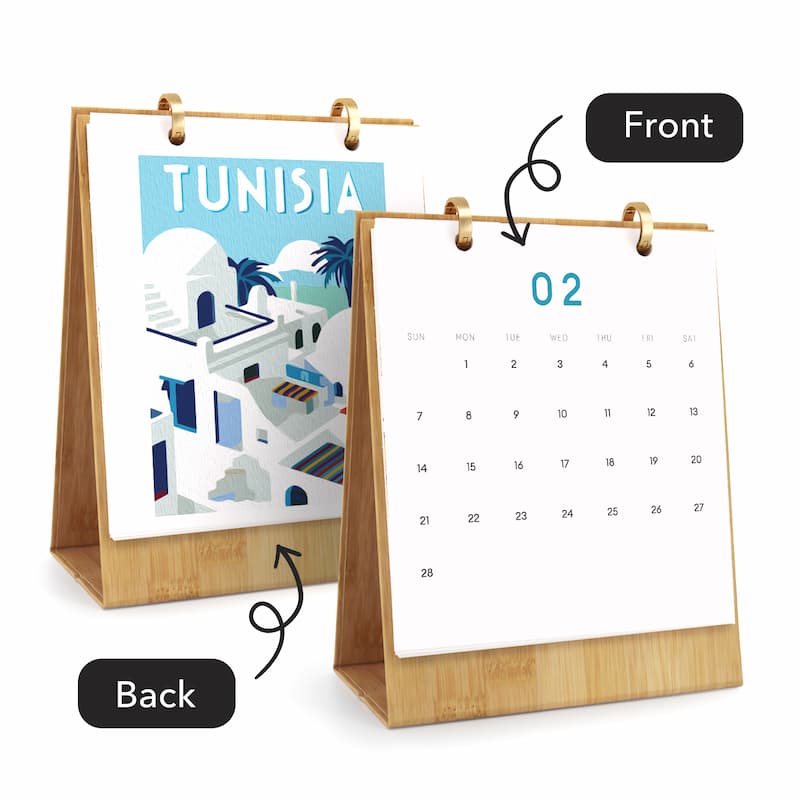 A bamboo desktop calendar shown from both front and back. The front view shows a white page with the number 02 and a grid of days, while the back view shows a colorful travel-style illustration with the word TUNISIA.