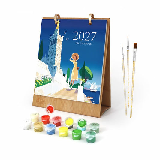 A 2027 dry landscape painting kit shown on a white background, featuring a wooden easel with a colorful illustrated cover, multiple small paint pots, and three paintbrushes.
