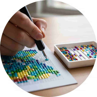 Person working on a diamond painting project with a box of colorful beads.
