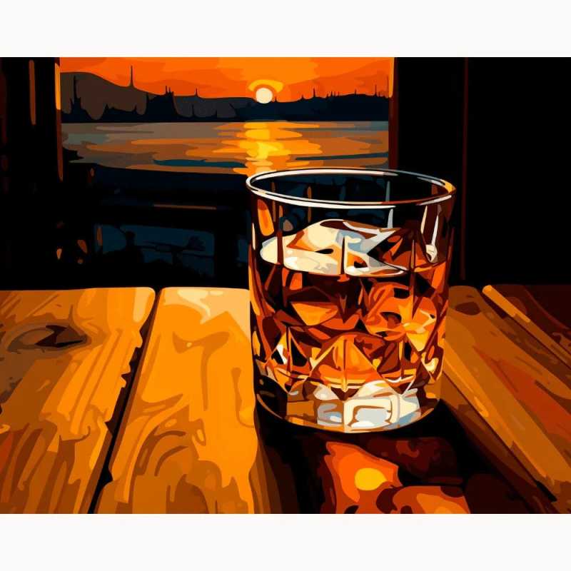 Paint by numbers canvas featuring a crystal whiskey glass on a wooden table, illuminated by the warm glow of a sunset over a calm lake and silhouetted skyline in the distance.