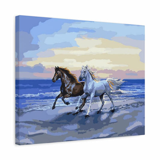 A square canvas painting depicting two horses running along a beach at sunset, with blue ocean water, a pale sky, and soft clouds. The canvas is shown at a slight angle against a plain white background.