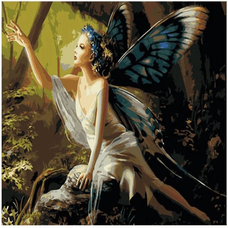 Whispering Wings Paint By Numbers artwork featuring a mystical fairy with blue butterfly wings reaching out in an enchanted forest, surrounded by warm light