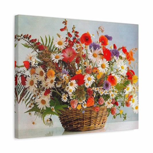 A square canvas wall art print depicting a vibrant wildflower bouquet in a wicker basket, shown at an angle to display its side depth against a plain white background.