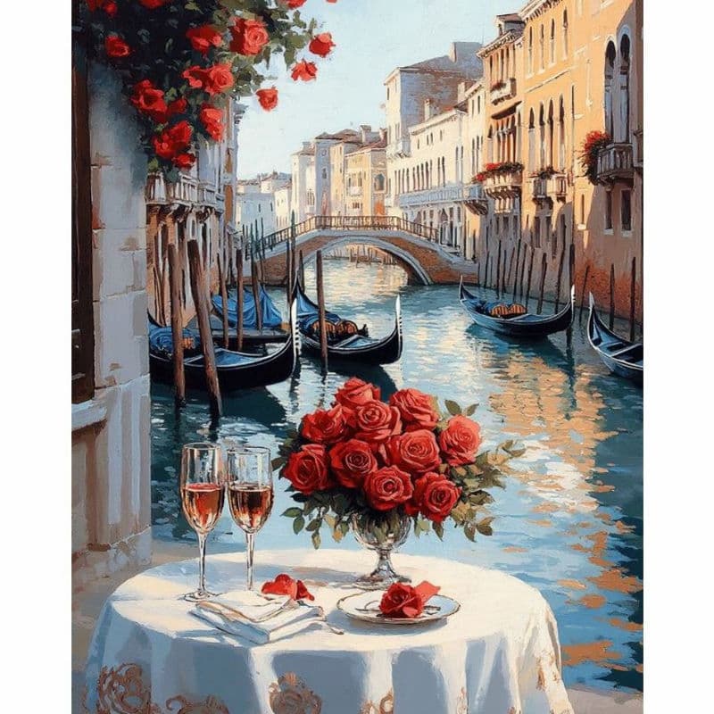 Venetian canal scene with gondolas, flowers, and wine glasses on a table.