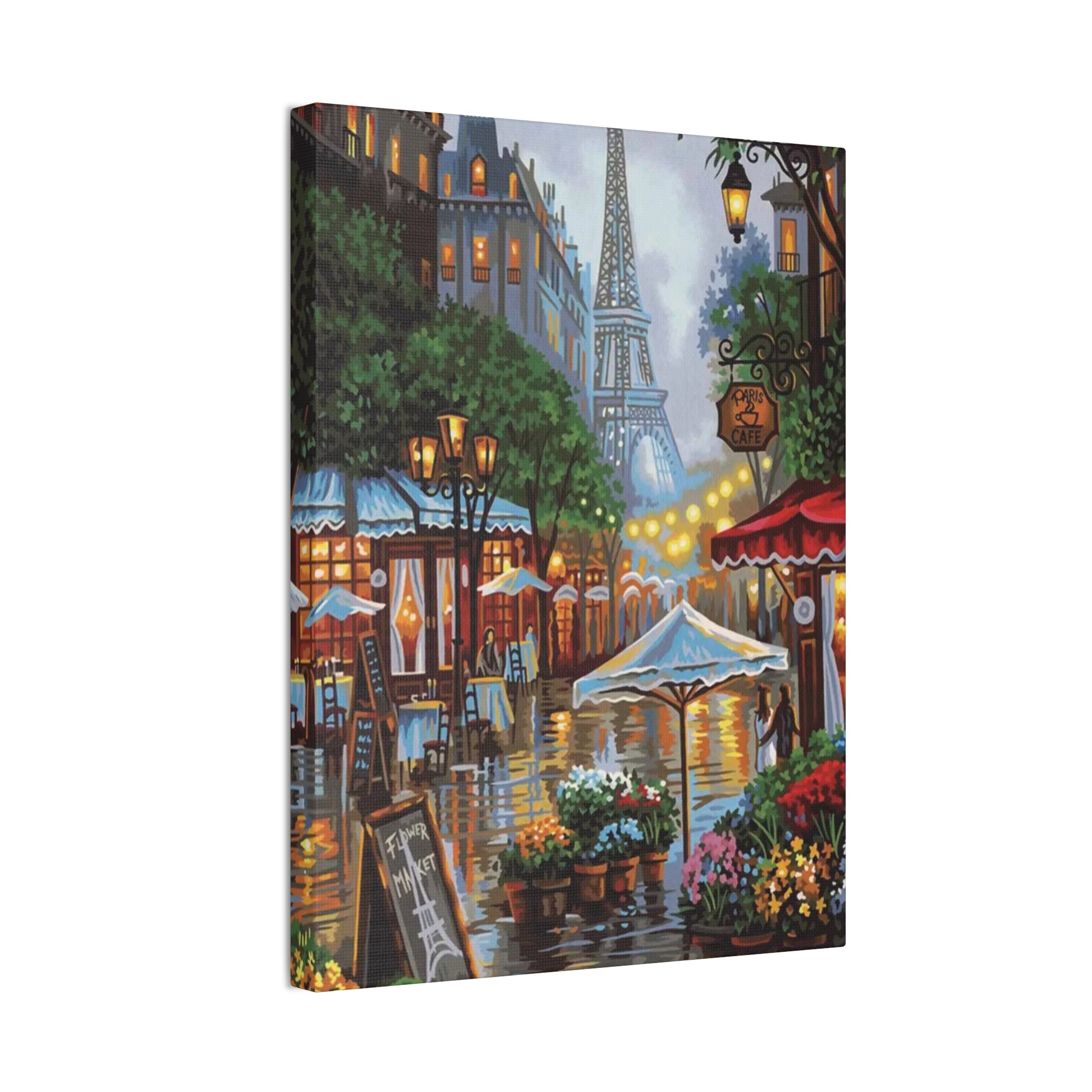Romantic Parisian street scene with blooming pink flowers and city charm captured in a paint by numbers kit for adults shown in a frame. 