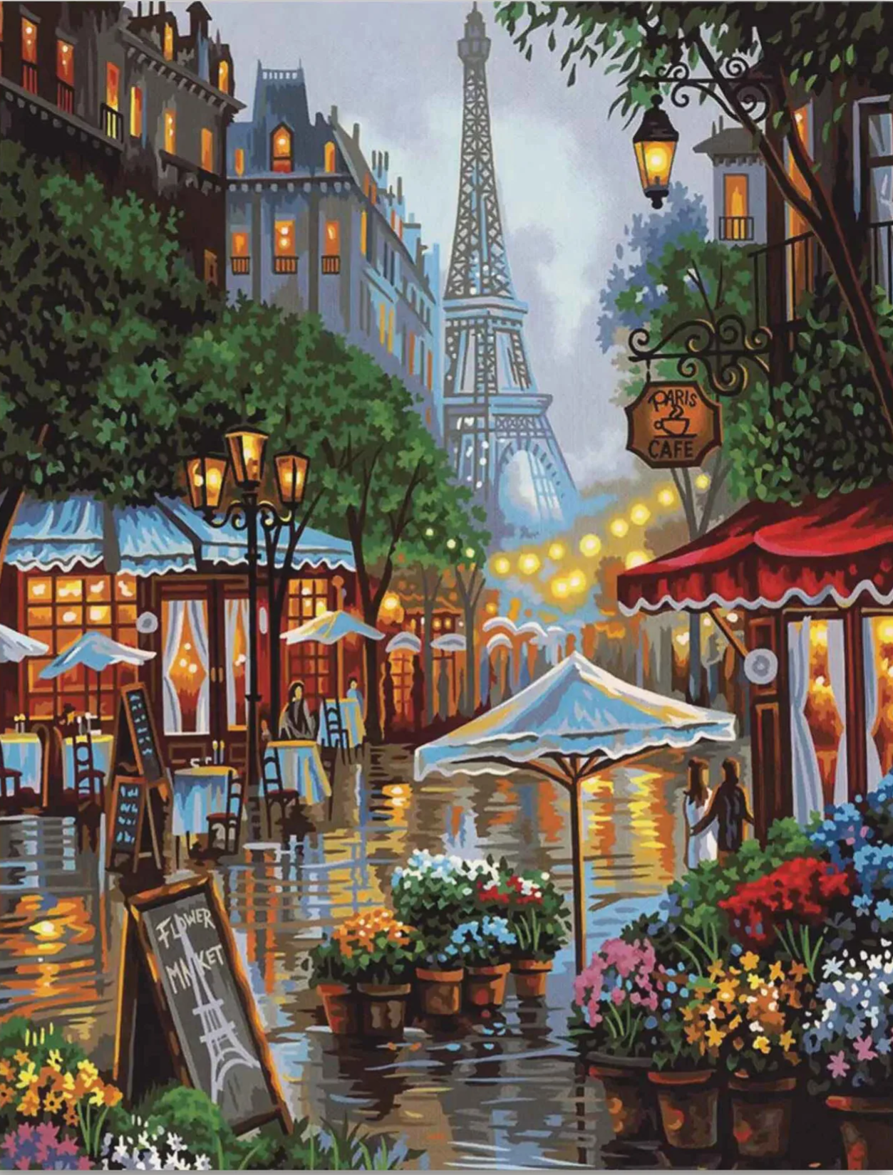 Romantic Parisian street scene with blooming pink flowers and city charm captured in a paint by numbers kit for adults.