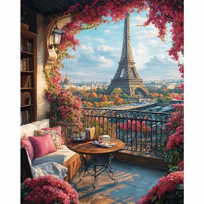 Balcony with Eiffel Tower view, decorated with flowers and furniture.