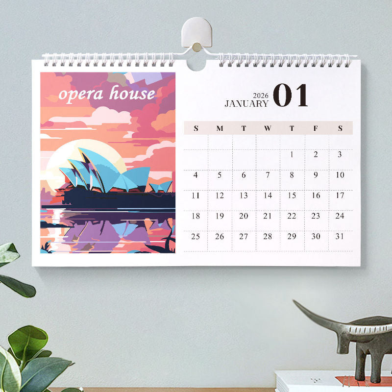 Paint by numbers calendar hanging on a wall, featuring a Sydney Opera House illustration on the January 2026 page with a clean monthly date grid.