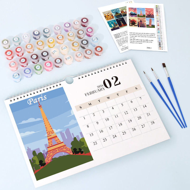 Paint by numbers calendar open to the February 2026 page, featuring a Paris Eiffel Tower illustration on the left and a minimalist monthly calendar grid on the right.