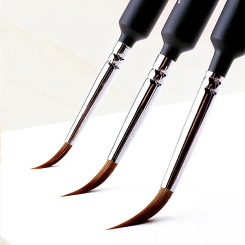 Set of four paintbrushes with black handles on a white background