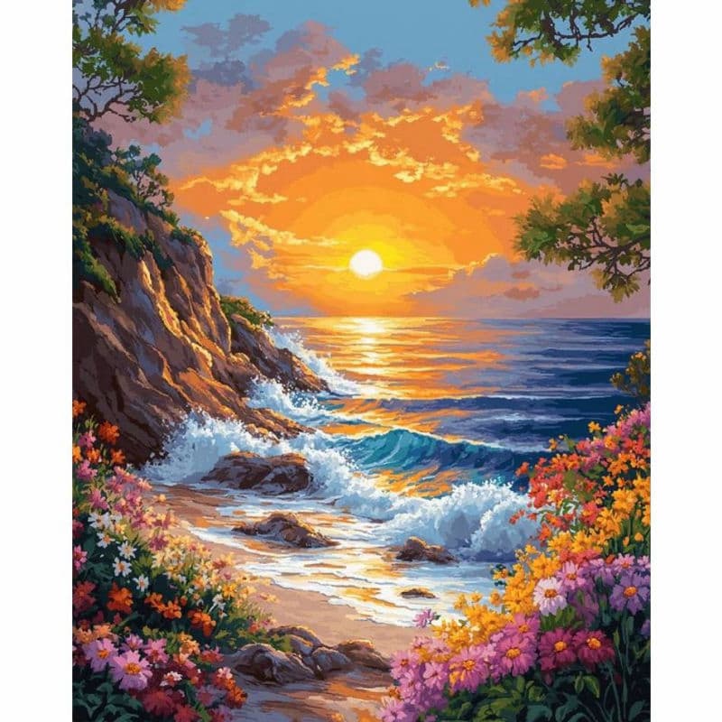 Sunset over a rocky beach with flowers and trees
